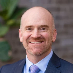 Headshot of Erik Christopher, broker